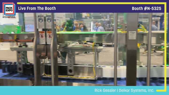 Live booth coverage from Pack Expo International showing equipment display and attendees inside booth N-5325
