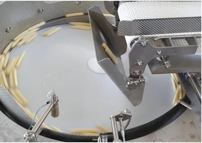 Overhead view of drum kit setup with white drum head, metal hardware, and cymbal stands