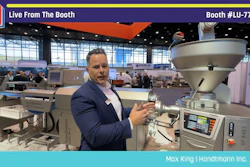 Professional demonstrating industrial packaging equipment at Pack Expo booth LU-7728 trade show