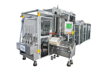 Industrial automated assembly machine with white frame, control panel, and safety guards for manufacturing operations