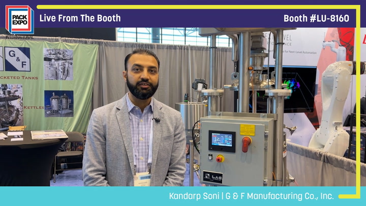 Man presenting industrial manufacturing equipment at Pack Expo trade show booth LU-8160