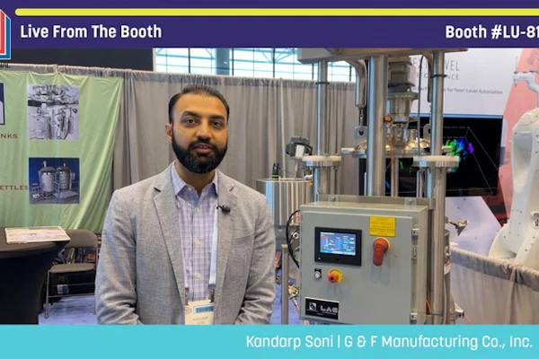 Man presenting industrial manufacturing equipment at Pack Expo trade show booth LU-8160
